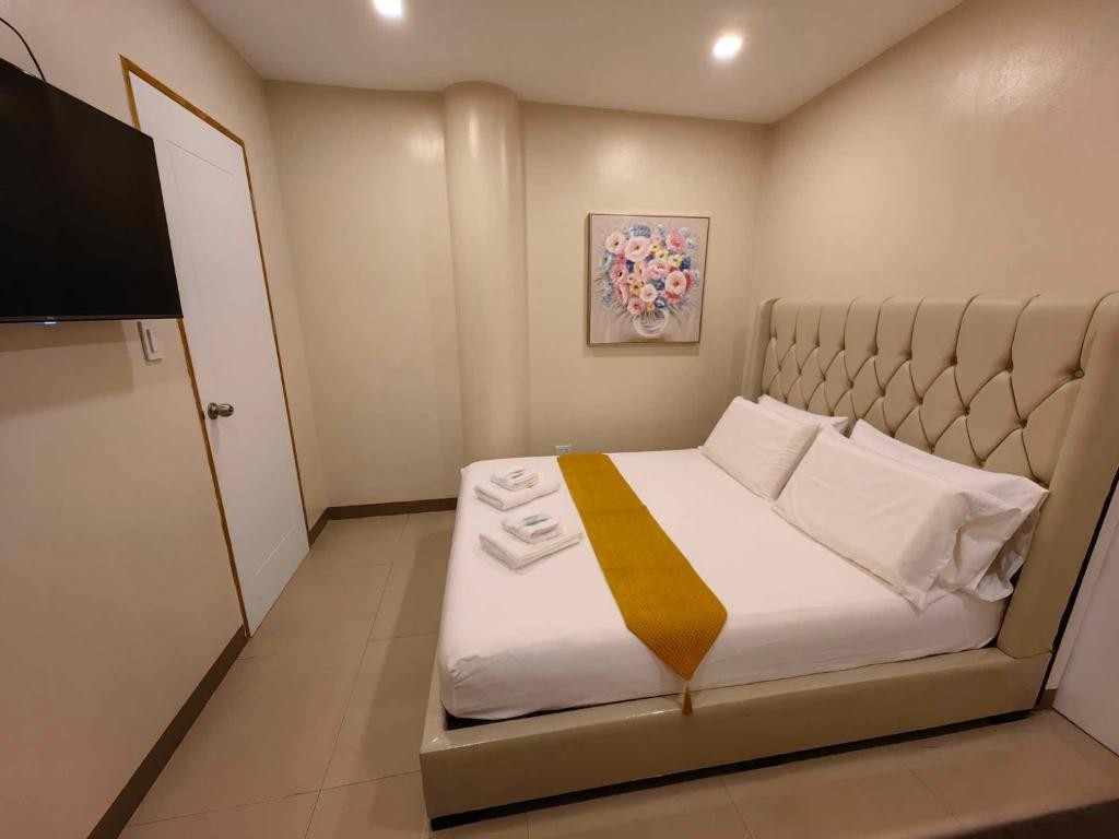 Voodi või voodid majutusasutuse PrimeRose Residences - Near Mactan-Cebu International Airport toas