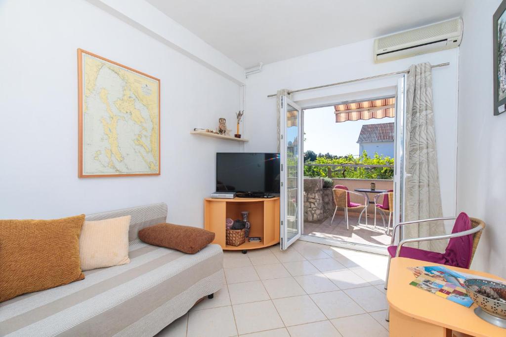 Televízia a/alebo spoločenská miestnosť v ubytovaní Apartment TODOR