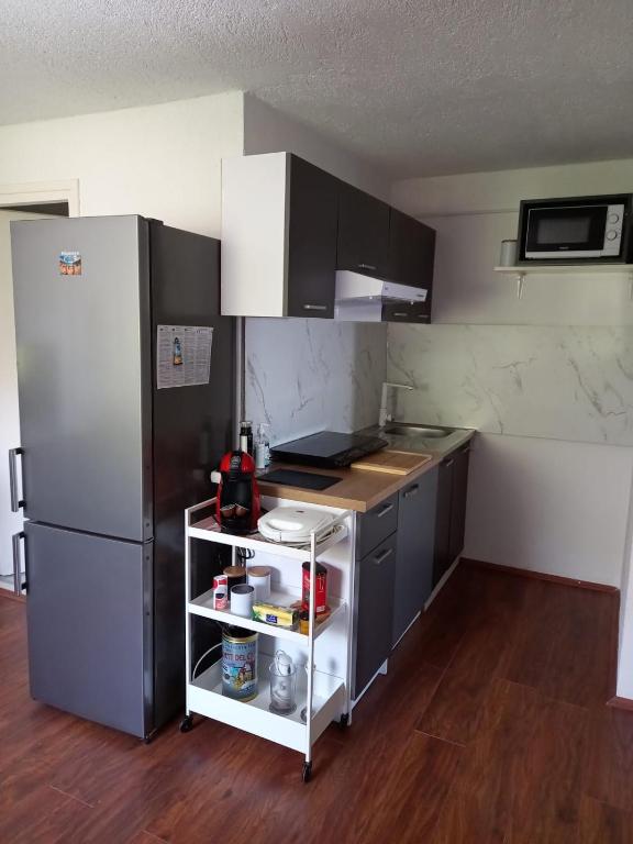 Kuchyň nebo kuchyňský kout v ubytování Apartmani 'Cvit'
