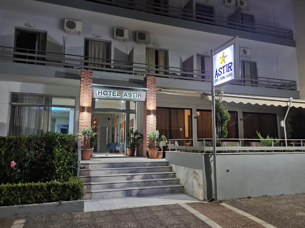 a hotel agent sign in front of a building at ASTIR COSY LIVING HOTEL in Agios Konstantinos