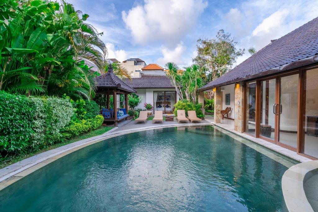 an image of a swimming pool in a house at Villa Aveli Seminyak by Best Deals Asia Hospitality in Seminyak