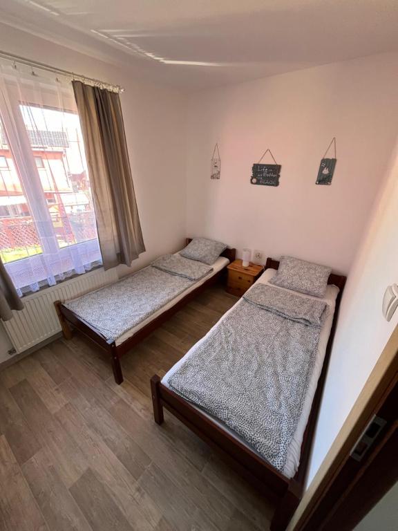 Postel nebo postele na pokoji v ubytování Ranczo u Korby