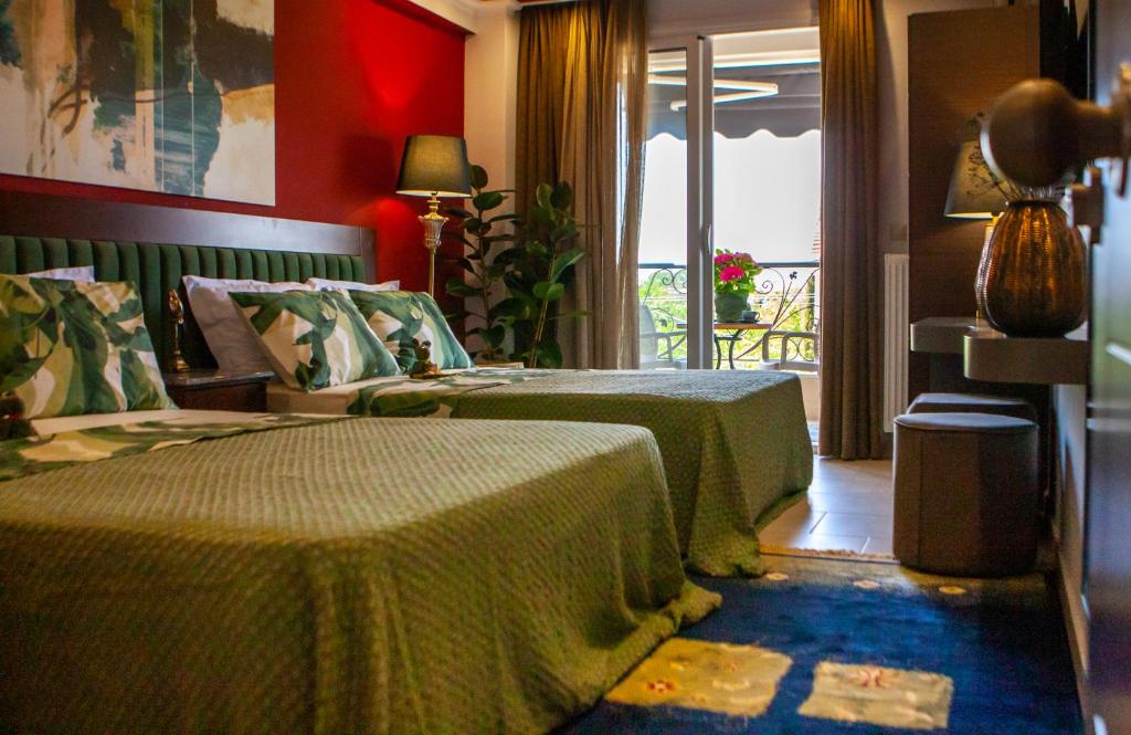 Postel nebo postele na pokoji v ubytování Art Hotel Aronos