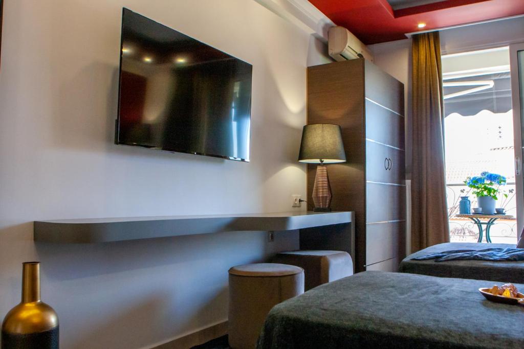 TV a/nebo společenská místnost v ubytování Art Hotel Aronos