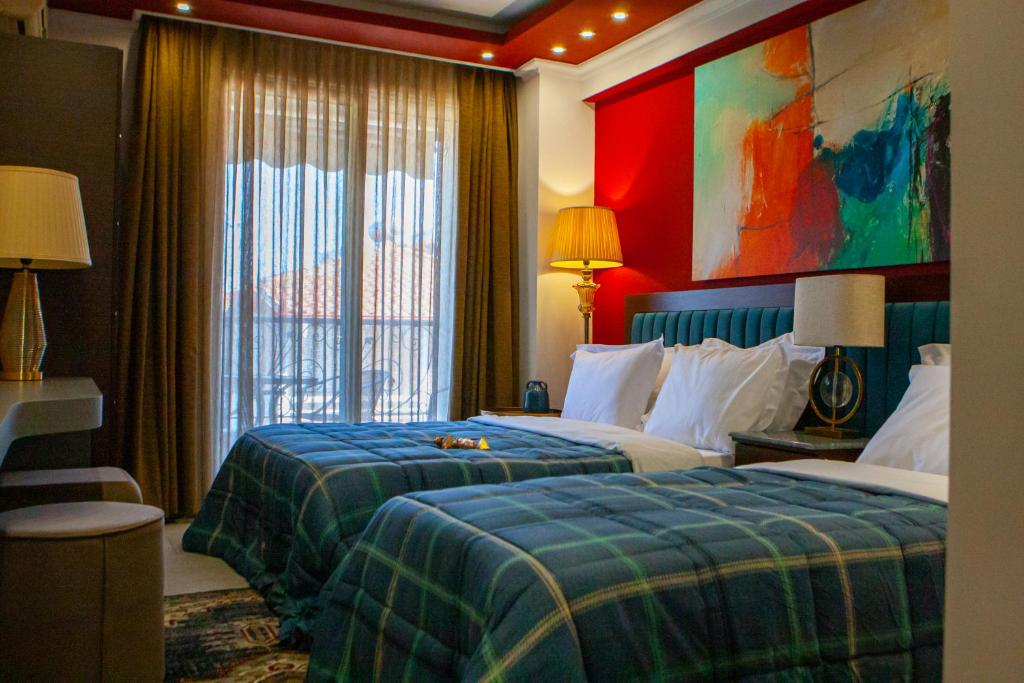 Postel nebo postele na pokoji v ubytování Art Hotel Aronos