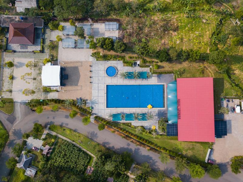 an aerial view of a house with a swimming pool at Pelangi Park Hotel & Resort in Pasirkuda