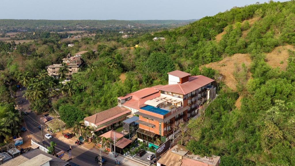 an aerial view of a building on a hill at HOLITEL ANJUNA GOA in Anjuna