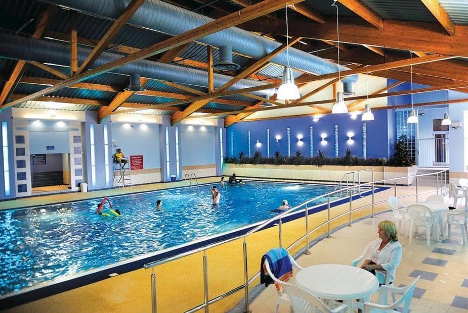 a large swimming pool with people in the water at Crescent 6 in Christchurch