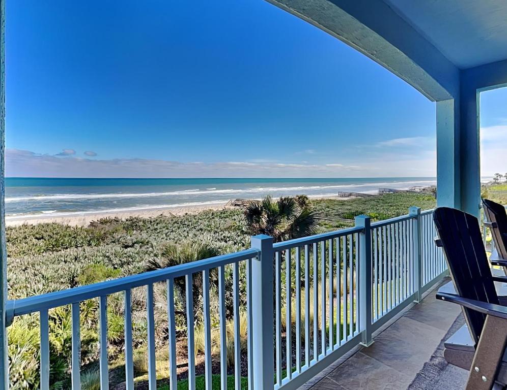 a view of the beach from the porch of a beach house at 832 Cinnamon Beach, 3 Bedroom, Sleeps 8, Ocean Front, 2 Pools, Elevator in Palm Coast