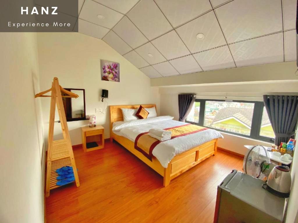 Postel nebo postele na pokoji v ubytování S79 Hoa Dang Hotel