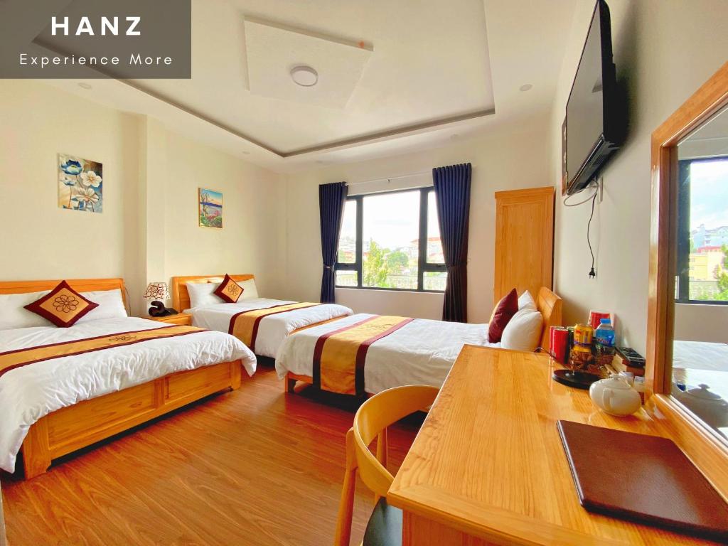 Postel nebo postele na pokoji v ubytování S79 Hoa Dang Hotel