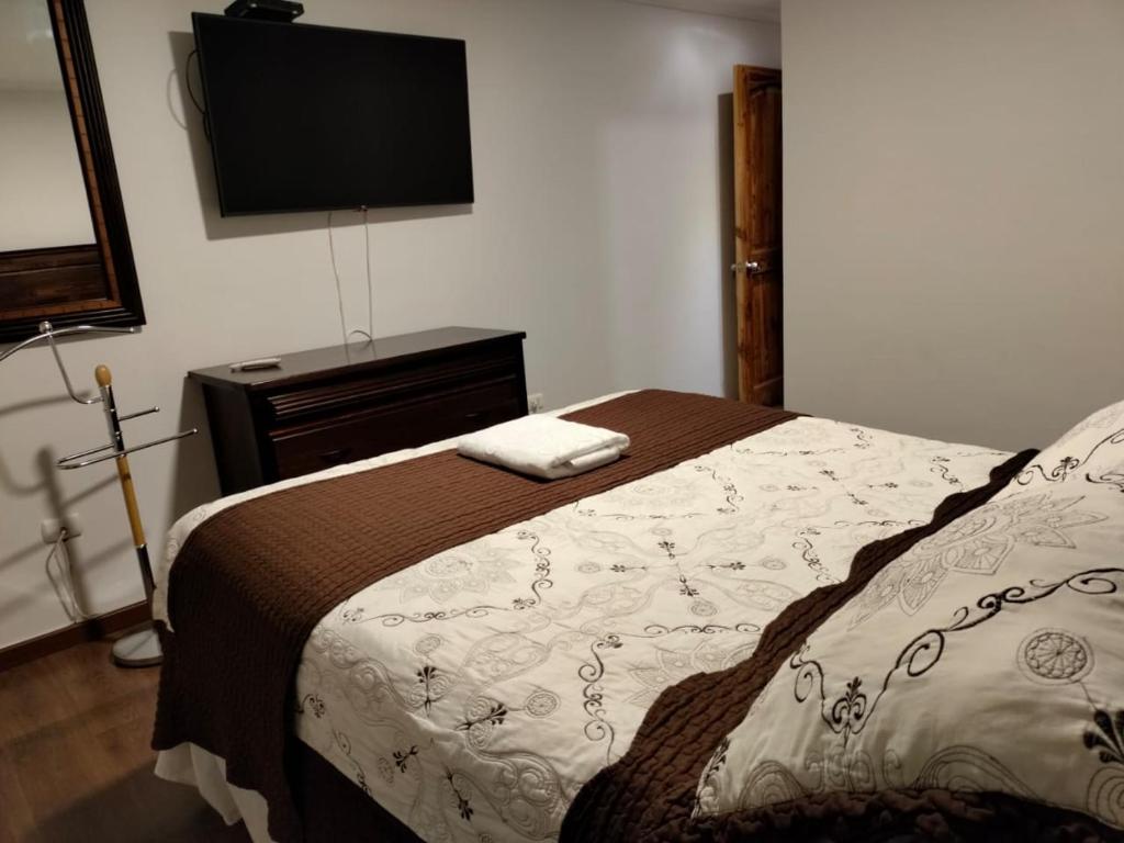Postel nebo postele na pokoji v ubytování HOTEL QUINTA ESTACIÓN