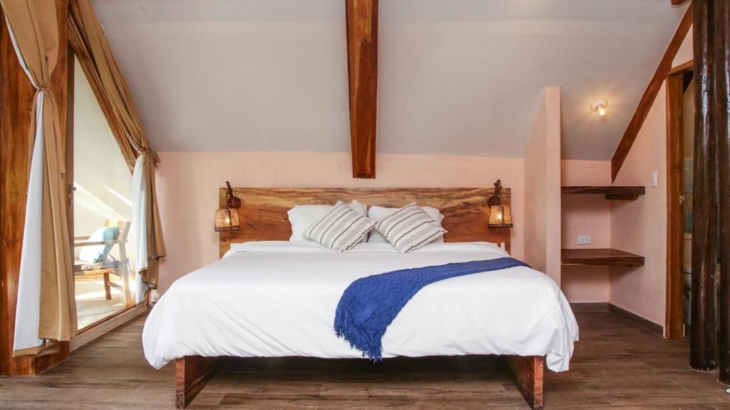 Postel nebo postele na pokoji v ubytování Masaya Brisa Tranquila -Suite - Colombia