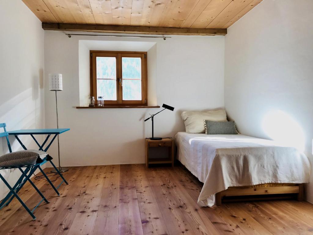 Postel nebo postele na pokoji v ubytování Chasa Pro la Tuor