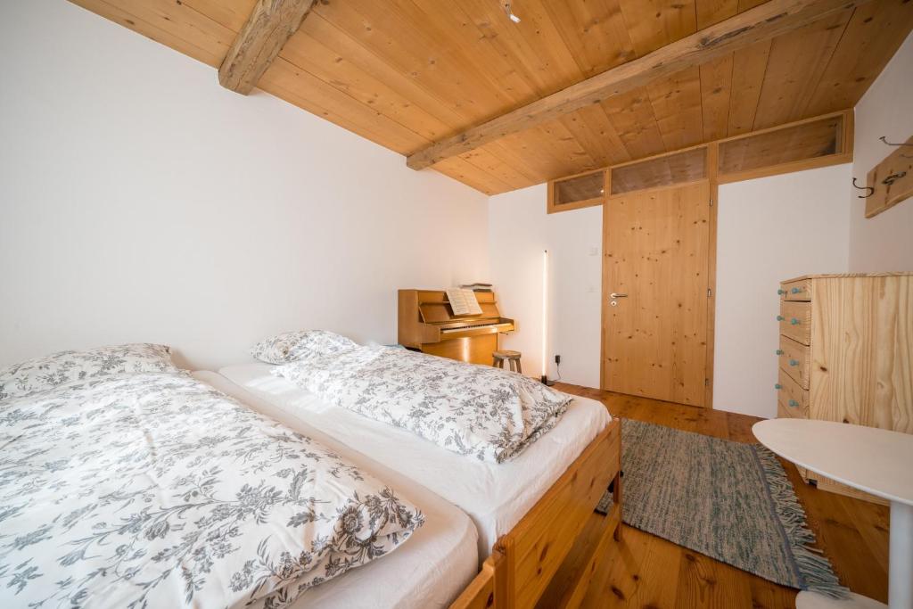 Postel nebo postele na pokoji v ubytování Chasa Pro la Tuor
