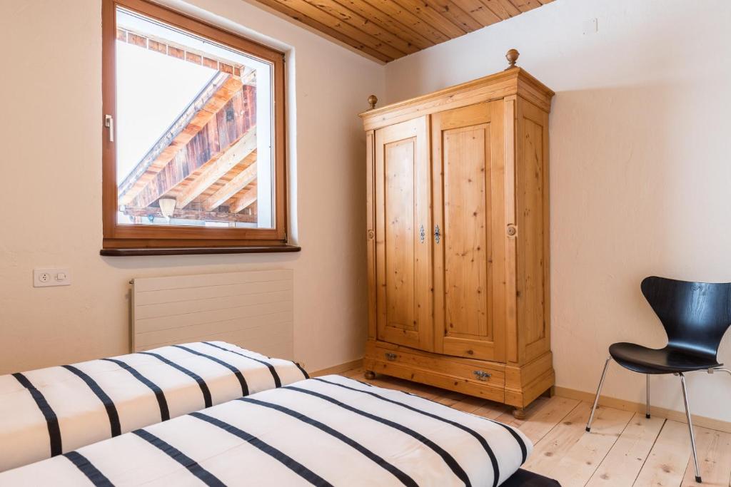 Postel nebo postele na pokoji v ubytování Chasa La Tschuffa