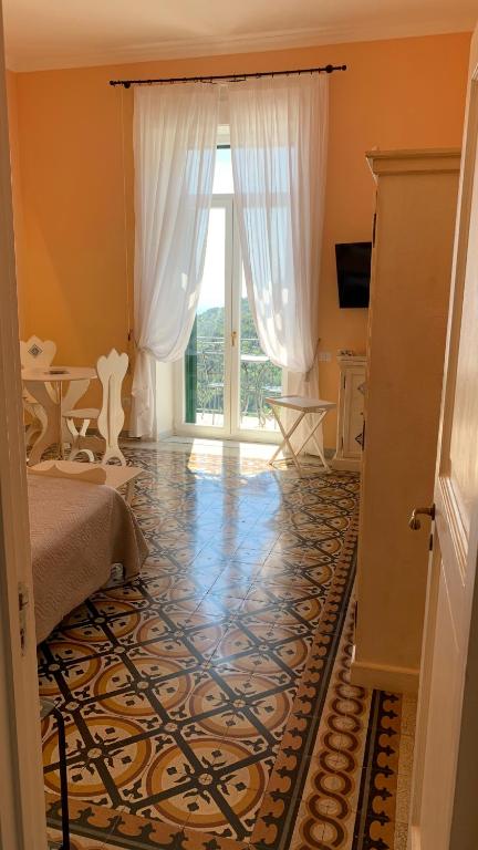 Televízia a/alebo spoločenská miestnosť v ubytovaní villa verde sul mare