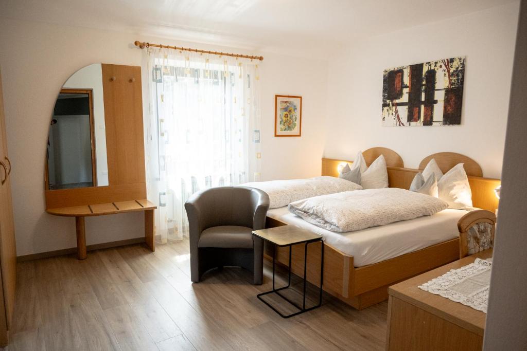 Postel nebo postele na pokoji v ubytování Garni Meinrad