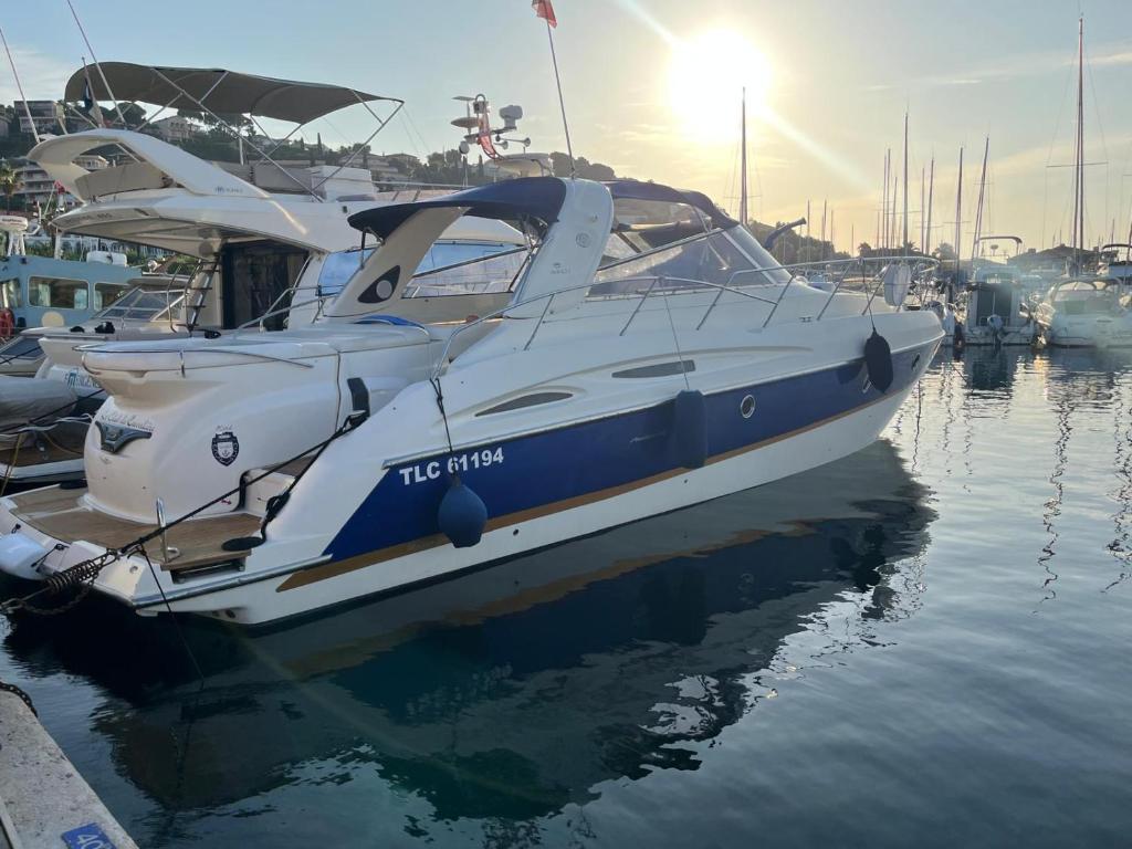 a boat is docked at a dock in the water at Bateau Cranchi 47 Méditerranée 1150cv in Cannes