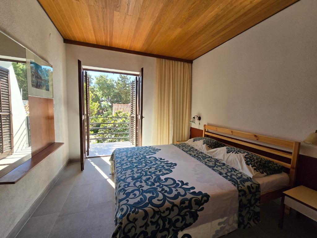 Posteľ alebo postele v izbe v ubytovaní Apartmani Origo