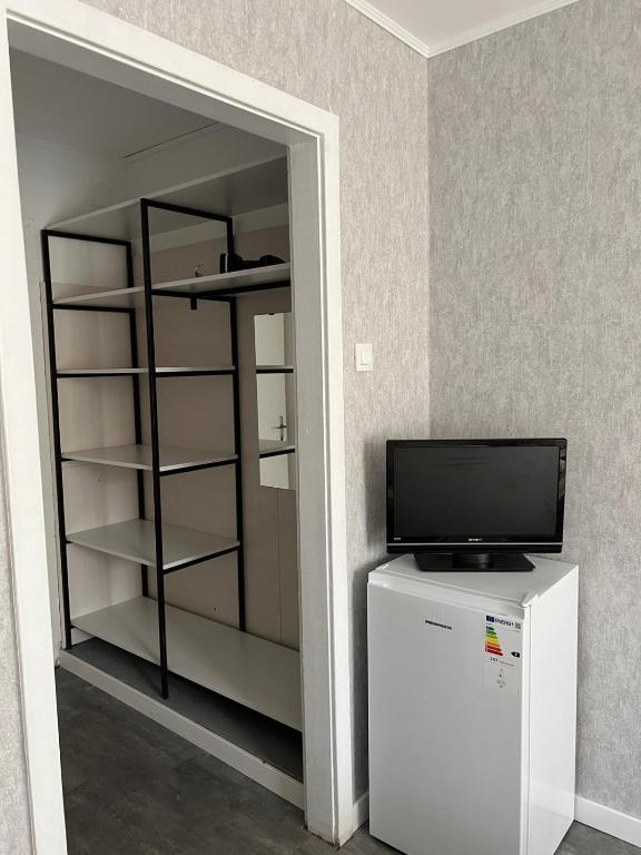 TV a/nebo společenská místnost v ubytování Legacy Hotel
