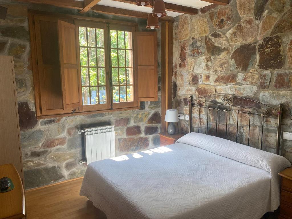 Posteľ alebo postele v izbe v ubytovaní Hotel Rural Camino Medulas