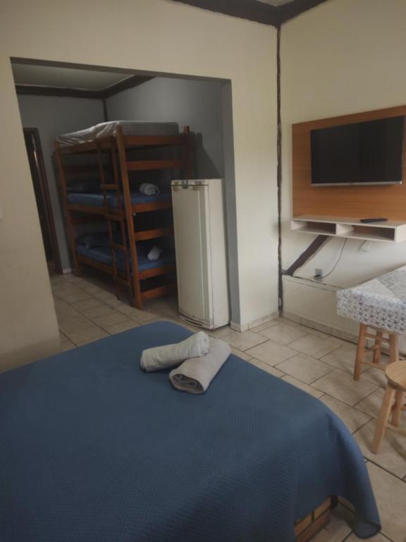 Cama ou camas em um quarto em Pousada Martin Pescador Bombinhas