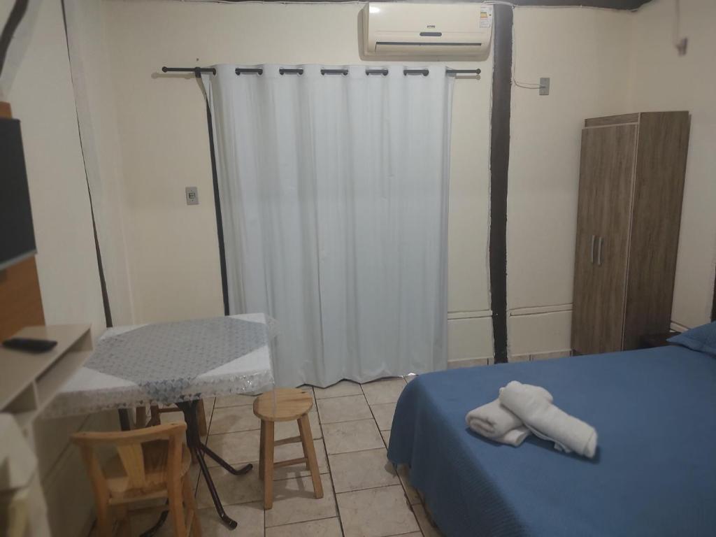 Cama ou camas em um quarto em Pousada Martin Pescador Bombinhas