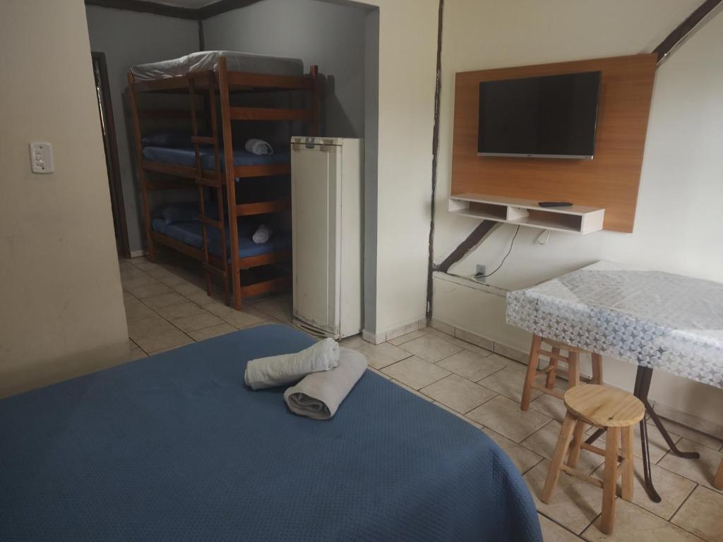 Cama ou camas em um quarto em Pousada Martin Pescador Bombinhas