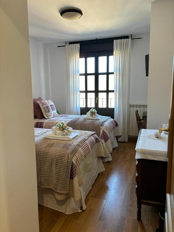 A bed or beds in a room at Apartamento Mirador del Pantano 1