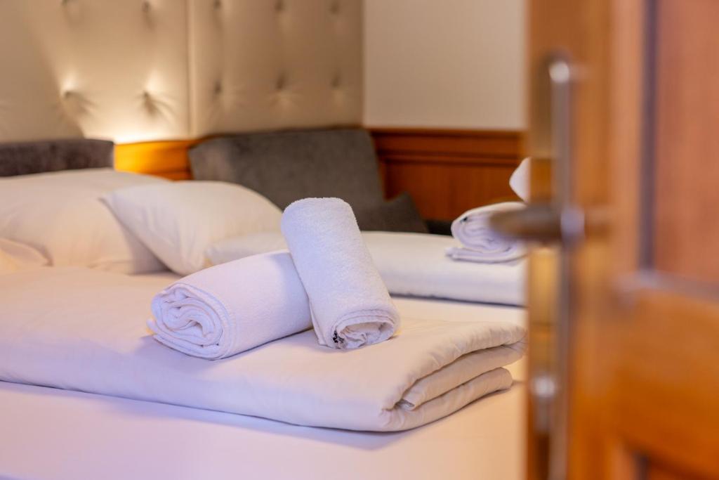 Posteľ alebo postele v izbe v ubytovaní Szinbád Hotel