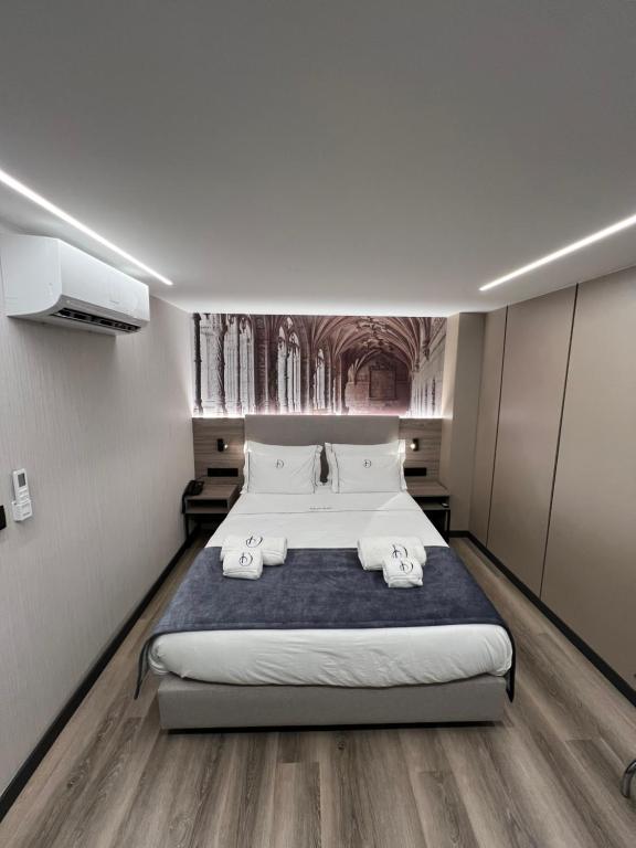 Postel nebo postele na pokoji v ubytování Dom João Glamour Hotel