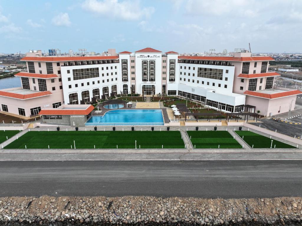 an aerial view of a building with a swimming pool at Djibouti Ayla Grand Hotel in Djibouti