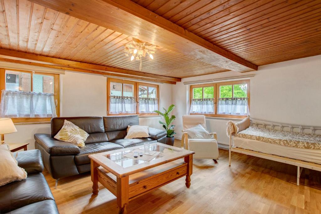 a living room with a couch and a table at Haus Maria in Laufen