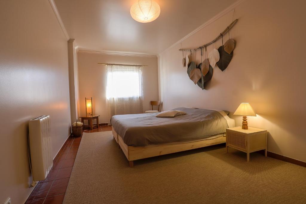 Postel nebo postele na pokoji v ubytování BE LOST - Pedra do Ouro Guest House