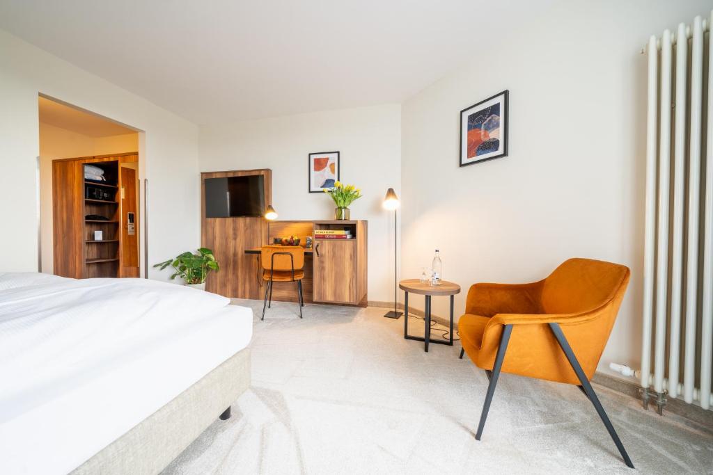 Postel nebo postele na pokoji v ubytování SOLTHUS Hotel&SPA