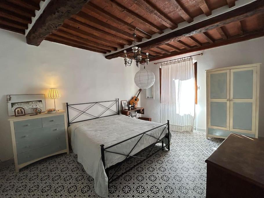 Postel nebo postele na pokoji v ubytování La dolce casa del polpo rosa