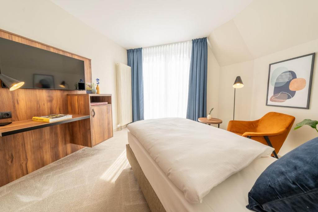 Postel nebo postele na pokoji v ubytování SOLTHUS Hotel&SPA