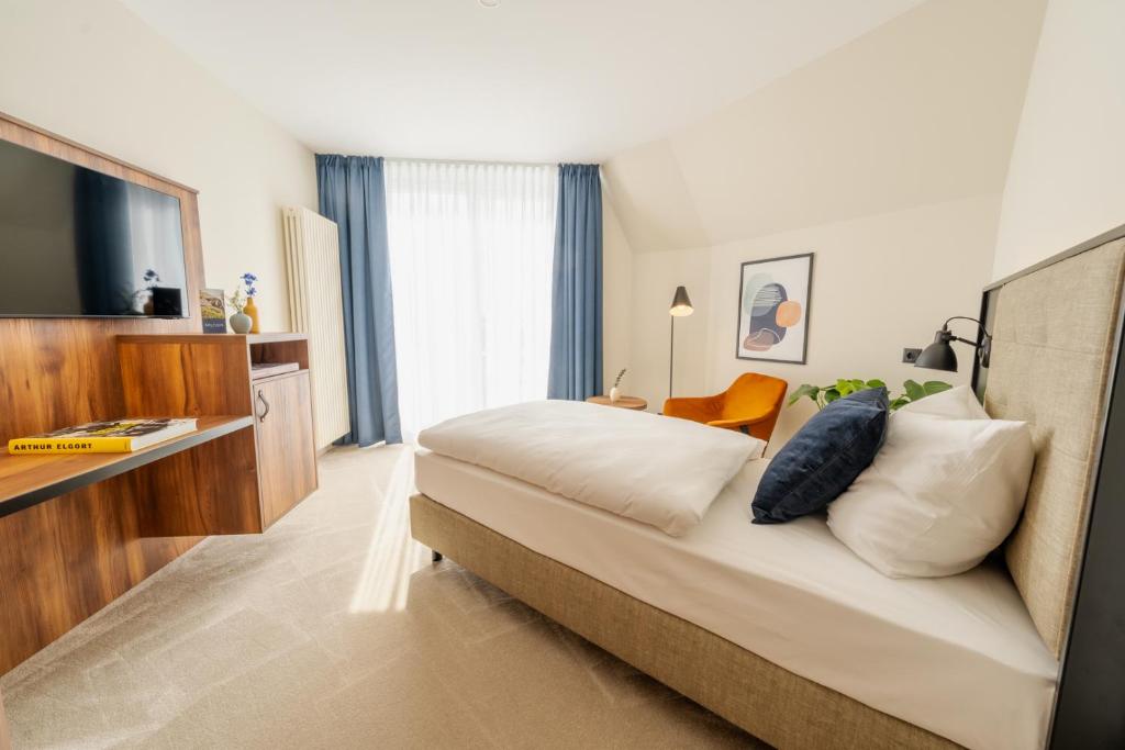 Postel nebo postele na pokoji v ubytování SOLTHUS Hotel&SPA