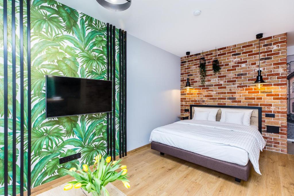 A bed or beds in a room at Komfortowy apartament w dobrej lokalizacji