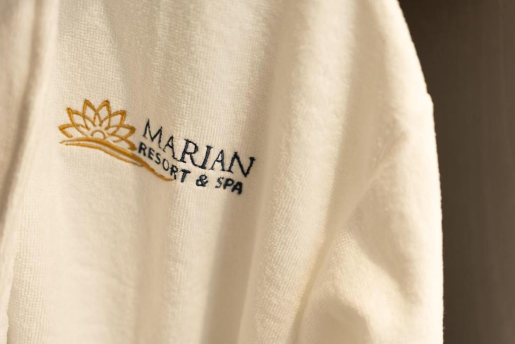 a white shirt with a logo on it at Marian Resort And Spa in Prestatyn