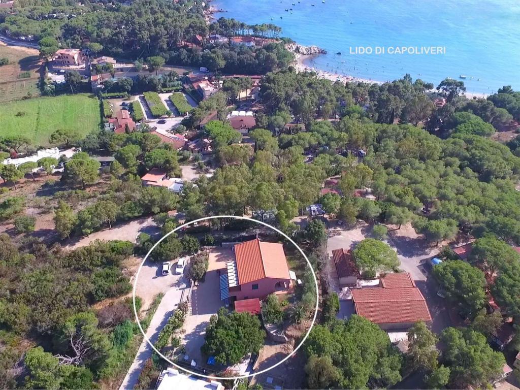 an aerial view of a house with a circle around it at Appartamenti La Risacca - ArgonautiVacanze in Capoliveri