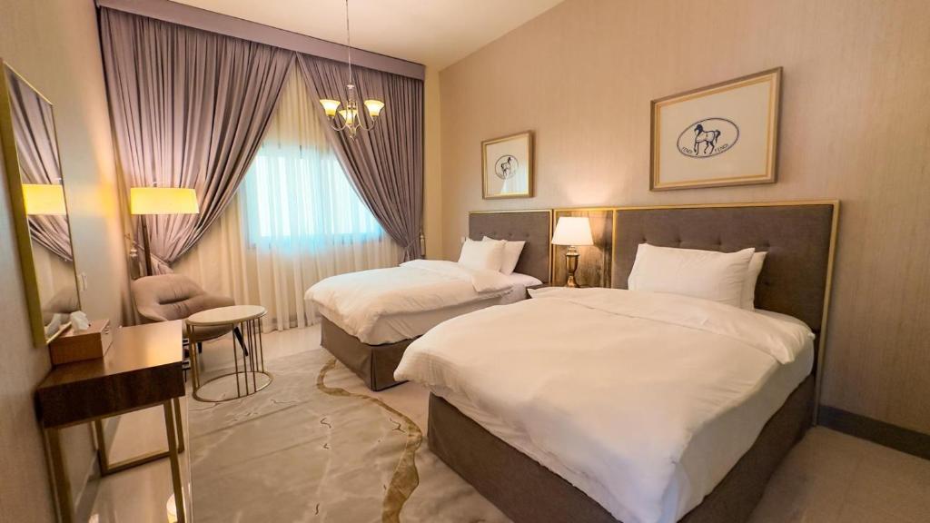 Postel nebo postele na pokoji v ubytování HOOUD Apartments