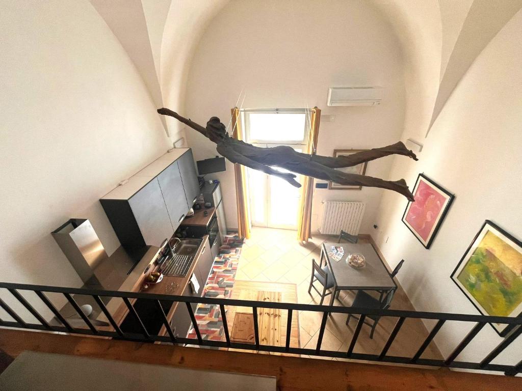 a person is doing a jump in a living room at La Nuotatrice in Lecce