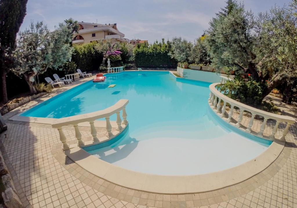 an image of a swimming pool in a resort at Cottage Milvia in Tortoreto Lido