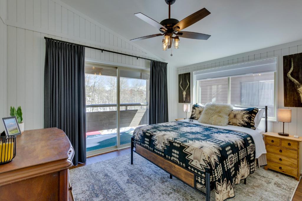 a bedroom with a bed and a window at Cozy La Veta Condo Walk to Cuchara Mountain Park! in La Veta