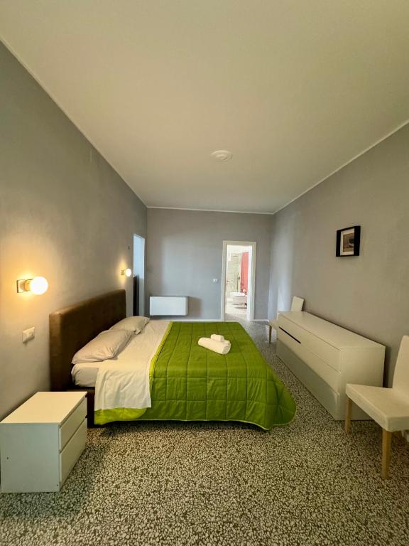 Posteľ alebo postele v izbe v ubytovaní 4 Balconi rooms Paladini B&B e appartamenti