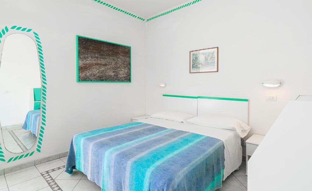Postel nebo postele na pokoji v ubytování Hotel Marconi