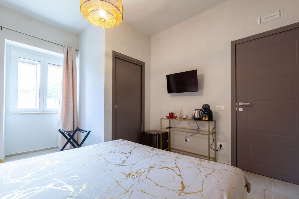 TV a/nebo společenská místnost v ubytování Malva Rooms
