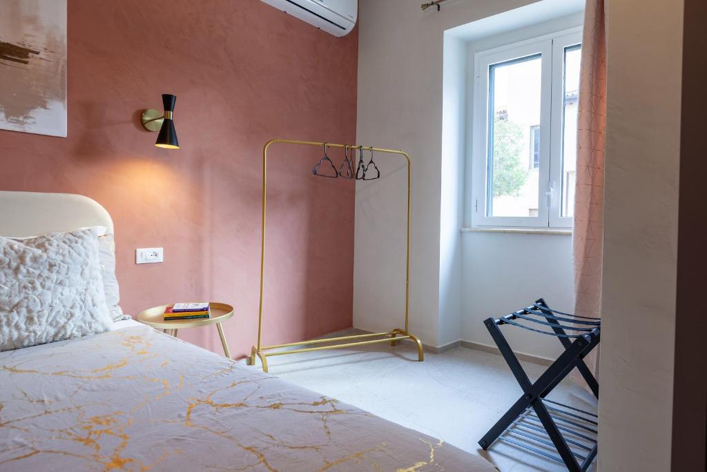 Postel nebo postele na pokoji v ubytování Malva Rooms